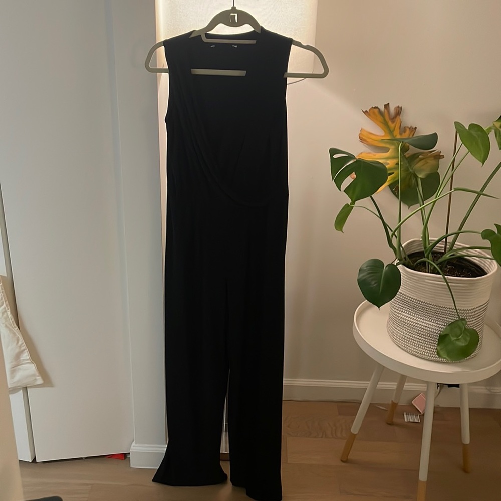 Black jumpsuit, full length.